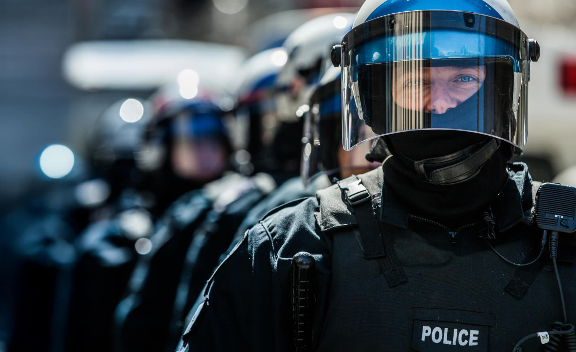 row of police in riot gear